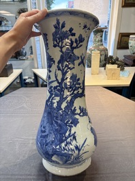 A Chinese blue and white vase with birds among flowering branches, Kangxi
