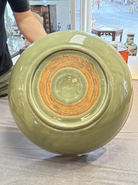 A rare and large Chinese Longquan celadon 'lotus bouquet' dish, Ming, early 15th C.
