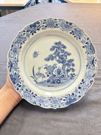 18 Chinese blue and white plates and saucers with floral design, 18th C.