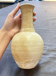 Three cream-glazed bottle vases and two jarlets from the Jepara shipwreck, Dehua or Anxi kilns, Song