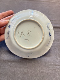 A set of 11 Chinese blue and white cups and saucers with riverscape design, Kangxi