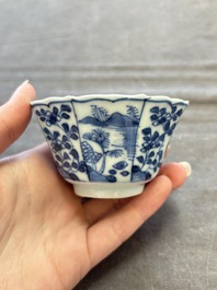 A set of 11 Chinese blue and white cups and saucers with riverscape design, Kangxi