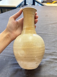 Three cream-glazed bottle vases and two jarlets from the Jepara shipwreck, Dehua or Anxi kilns, Song