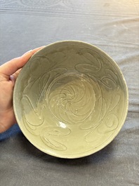 A group of 12 Chinese celadon-glazed bowls with incised floral design from the Jepara shipwreck, Fujian kilns, Song