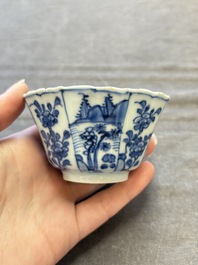 A set of 11 Chinese blue and white cups and saucers with riverscape design, Kangxi