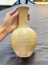 Three cream-glazed bottle vases and two jarlets from the Jepara shipwreck, Dehua or Anxi kilns, Song
