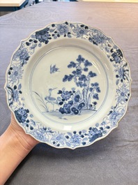 18 Chinese blue and white plates and saucers with floral design, 18th C.