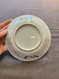 A set of 11 Chinese blue and white cups and saucers with riverscape design, Kangxi