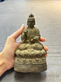 A Chinese bronze Taoist figure and a gilt-lacquered guardian, Ming