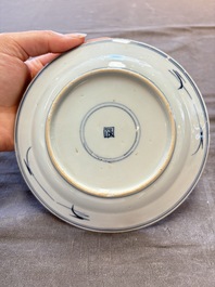 18 Chinese blue and white plates and saucers with floral design, 18th C.