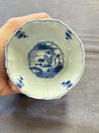 A set of 11 Chinese blue and white cups and saucers with riverscape design, Kangxi