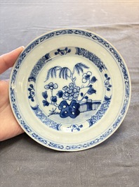 18 Chinese blue and white plates and saucers with floral design, 18th C.