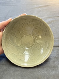 A group of 12 Chinese celadon-glazed bowls with incised floral design from the Jepara shipwreck, Fujian kilns, Song