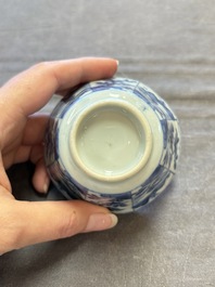 A set of 11 Chinese blue and white cups and saucers with riverscape design, Kangxi