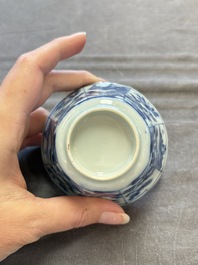 A set of 11 Chinese blue and white cups and saucers with riverscape design, Kangxi