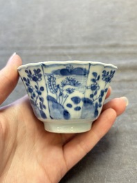 A set of 11 Chinese blue and white cups and saucers with riverscape design, Kangxi