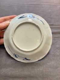 A set of 11 Chinese blue and white cups and saucers with riverscape design, Kangxi