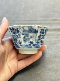 A set of 11 Chinese blue and white cups and saucers with riverscape design, Kangxi