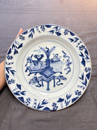 19 Chinese blue and white plates with antiquities, floral, and landscape design, Kangxi