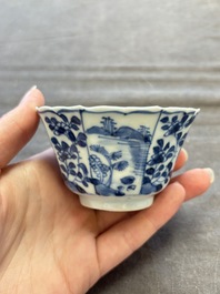 A set of 11 Chinese blue and white cups and saucers with riverscape design, Kangxi