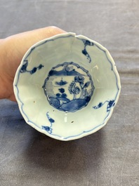A set of 11 Chinese blue and white cups and saucers with riverscape design, Kangxi
