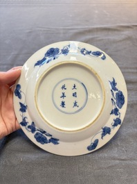 18 Chinese blue and white plates and saucers with floral design, 18th C.