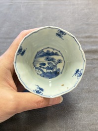 A set of 11 Chinese blue and white cups and saucers with riverscape design, Kangxi