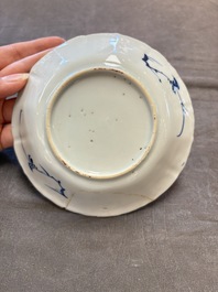 A set of 11 Chinese blue and white cups and saucers with riverscape design, Kangxi