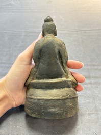 A Chinese bronze Taoist figure and a gilt-lacquered guardian, Ming