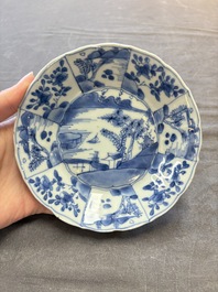 A set of 11 Chinese blue and white cups and saucers with riverscape design, Kangxi