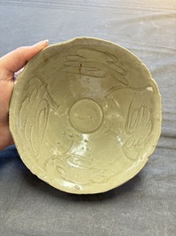 A group of 12 Chinese celadon-glazed bowls with incised floral design from the Jepara shipwreck, Fujian kilns, Song