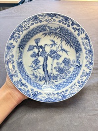18 Chinese blue and white plates and saucers with floral design, 18th C.