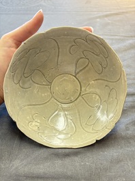 A group of 12 Chinese celadon-glazed bowls with incised floral design from the Jepara shipwreck, Fujian kilns, Song
