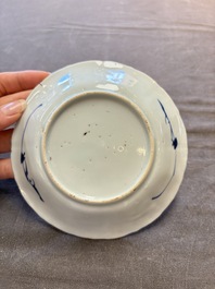 A set of 11 Chinese blue and white cups and saucers with riverscape design, Kangxi