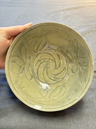 A group of 12 Chinese celadon-glazed bowls with incised floral design from the Jepara shipwreck, Fujian kilns, Song