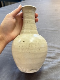 Three cream-glazed bottle vases and two jarlets from the Jepara shipwreck, Dehua or Anxi kilns, Song