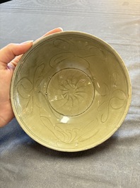 A group of 12 Chinese celadon-glazed bowls with incised floral design from the Jepara shipwreck, Fujian kilns, Song