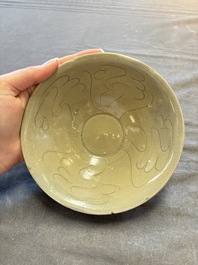 A group of 12 Chinese celadon-glazed bowls with incised floral design from the Jepara shipwreck, Fujian kilns, Song