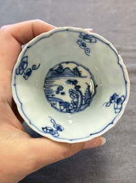 A set of 11 Chinese blue and white cups and saucers with riverscape design, Kangxi