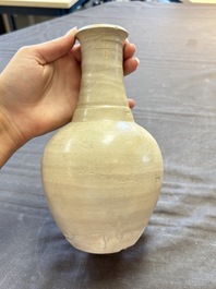 Three cream-glazed bottle vases and two jarlets from the Jepara shipwreck, Dehua or Anxi kilns, Song
