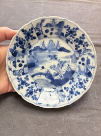 A set of 11 Chinese blue and white cups and saucers with riverscape design, Kangxi