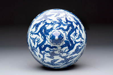 A Chinese blue and white 'dragon among clouds' cover, 20th C.