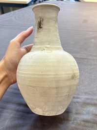 Three cream-glazed bottle vases and two jarlets from the Jepara shipwreck, Dehua or Anxi kilns, Song