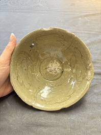 A group of 12 Chinese celadon-glazed bowls with incised floral design from the Jepara shipwreck, Fujian kilns, Song