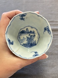 A set of 11 Chinese blue and white cups and saucers with riverscape design, Kangxi