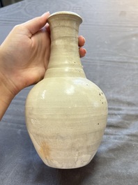 Three cream-glazed bottle vases and two jarlets from the Jepara shipwreck, Dehua or Anxi kilns, Song
