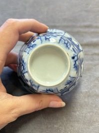A set of 11 Chinese blue and white cups and saucers with riverscape design, Kangxi