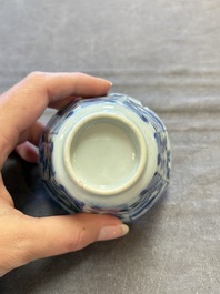 A set of 11 Chinese blue and white cups and saucers with riverscape design, Kangxi