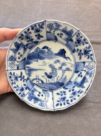 A set of 11 Chinese blue and white cups and saucers with riverscape design, Kangxi