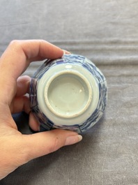 A set of 11 Chinese blue and white cups and saucers with riverscape design, Kangxi